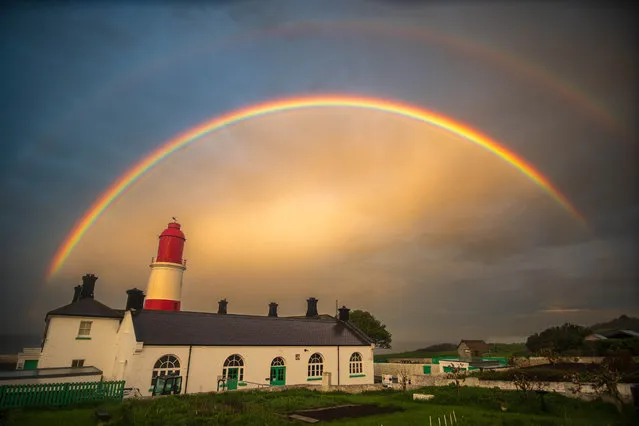 A beautiful double rainbow over Souter lighthouse in Whitburn, Tyne and Wear, North East England ends a rainy day on May 8, 2023. (Photo by Steven Lomas/Animal News Agency)