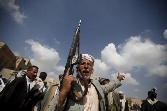 A tribesman loyal to the Houthi movement carries his rifle as he leaves a gathering held to show support for the group, in Yemen's capital Sanaa December 15, 2015. (Photo by Khaled Abdullah/Reuters)