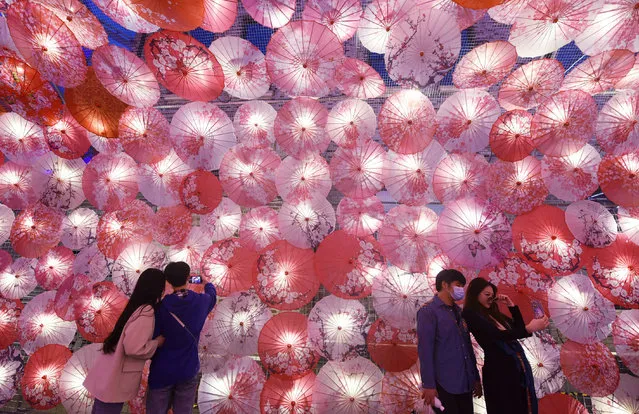 Thousands of “Umbrella Lantern” are seen along the streets in Hangzhou City, east China's Zhejiang Province, 22 February 2021. The installation is set up for the upcoming Spring Lantern Festival. (Photo by Rex Features/Shutterstock)