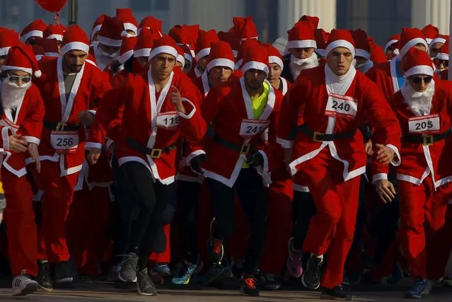 People dressed as Santa Claus run during a race in Skopje, Macedonia December 27, 2015. (Photo by Ognen Teofilovski/Reuters)