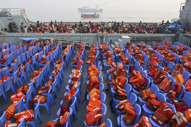 Life vests are placed on chairs as Rohingya refugees headed to the Bhasan Char island arrive to board navy vessels from the south eastern port city of Chattogram, Bangladesh, Monday, February 15,2021. Authorities sent a fourth group of Rohingya refugees to the newly developed island in the Bay of Bengal on Monday amid calls by human rights groups for a halt to the process. (Photo by AP Photo/Stringer)