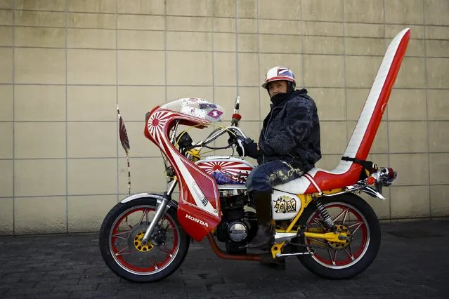 A biker poses on his Bousouzoku motorbike at the Dangouzaka rest stop in Yamanashi, west of Tokyo, Japan, January 3, 2016. (Photo by Thomas Peter/Reuters)