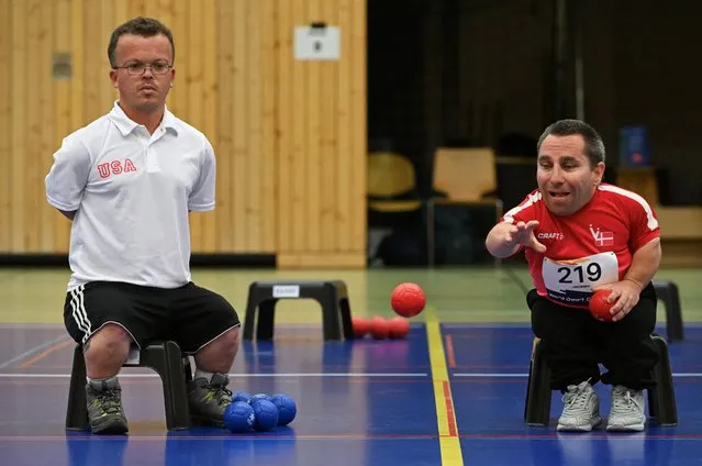 Dan Jacobsen, 43, of Denmark competes to win the Boccia finals against Sam Bremen of the USA at the World Dwarf Games in Cologne, Germany, August 2, 2023. (Photo by Jana Rodenbusch/Reuters)