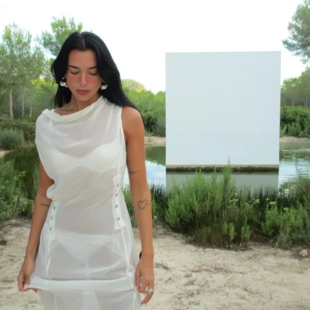English-Albanian singer and songwriter Dua Lipa in the last decade of August 2023 has been seen posing beside a lake in a see-through dress. (Photo by Instagram)