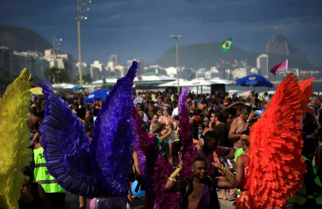 Revellers take part in the Gay Pride Parade at the Copacabana beach in Rio de Janeiro, Brazil, December 11, 2016. (Photo by Pilar Olivares/Reuters)