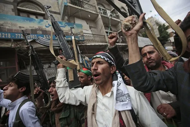 Houthi supporters hold their weapons as they chant slogans during a protest against Israeli attacks on Palestinians in Gaza, Monday, May 17, 2021, in Sanaa, Yemen. (Photo by Hani Mohammed/AP Photo)