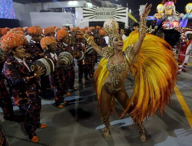 Revellers parade for Gavioes da Fiel samba school during carnival in Sao Paulo, Brazil, February 6, 2016. (Photo by Paulo Whitaker/Reuters)