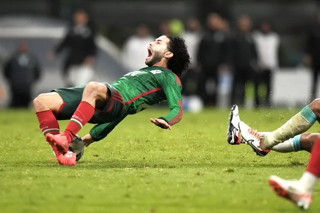 Mexico's Cesar Huerta falls on the pitch after he is fouled by Honduras' Denil Maldonado, during a CONCACAF Nations League quarterfinal second leg soccer match, at Azteca stadium in Mexico City, Tuesday, November 21, 2023. El Tri went on to defeat Honduras 4-2 on penalty kicks to qualify for next year's Copa America. (Phoot by Eduardo Verdugo/AP Photo)