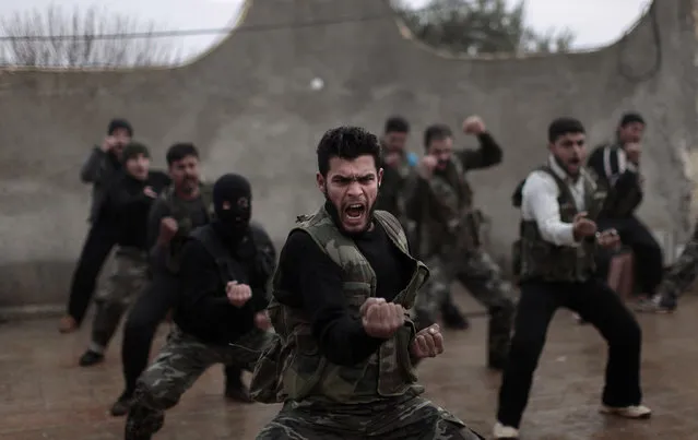 Syrian rebels attend a training session in Maaret Ikhwan, near Idlib, Syria, Monday, December 17, 2012. (Photo by Muhammed Muheisen/AP Photo)