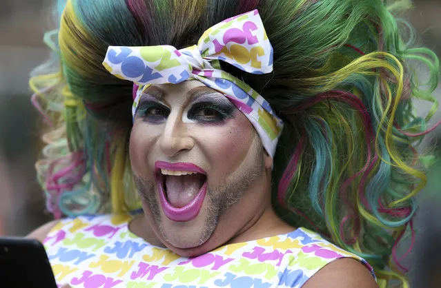 A participant smiles as he prepares for the annual Gay and Lesbian Mardi Gras in Sydney, Saturday, March 2, 2019. The 41st parade features almost 200 floats. (Photo by Rick Rycroft/AP Photo)