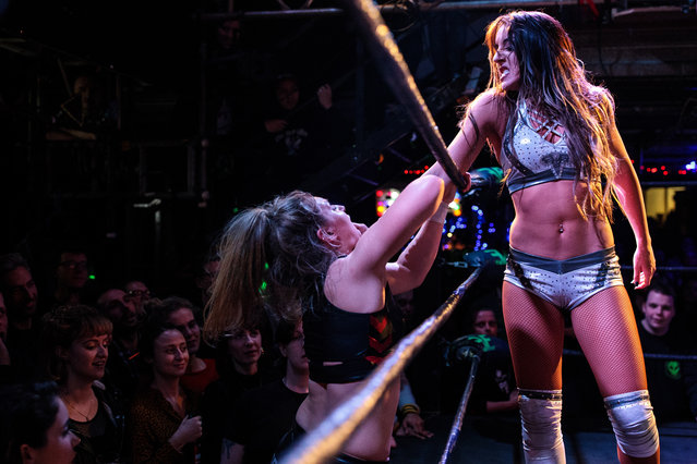 Wrestlers perform during an all-female wrestling event on International Women's Day at the Resistance Gallery in Bethnal Green on March 8, 2019 in London, England. (Photo by Jack Taylor/Getty Images)