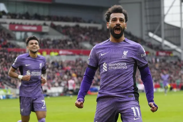 Liverpool's Mohamed Salah celebrates scoring his sides third goal during the English Premier League soccer match between Brentford and Liverpool at the Gtech Community Stadium in London, Saturday, February 17, 2024. (Photo by Kirsty Wigglesworth/AP Photo)