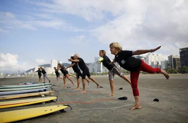 Elderly people take part in their surf class in Santos, Sao Paulo state, Brazil March 17, 2016. When work is up, surf is up in Brazil. A group of pensioners take to the waves in keep-fit, keep-young surfing lessons that aim to show age is just a number. Edmea Pereira and Francisco de Aguiar, a retired husband and wife in their 70s, take classes three times a week, for free, at the Cisco Arana surf school in the city of Santos in the state of Sao Paolo. (Photo by Nacho Doce/Reuters)