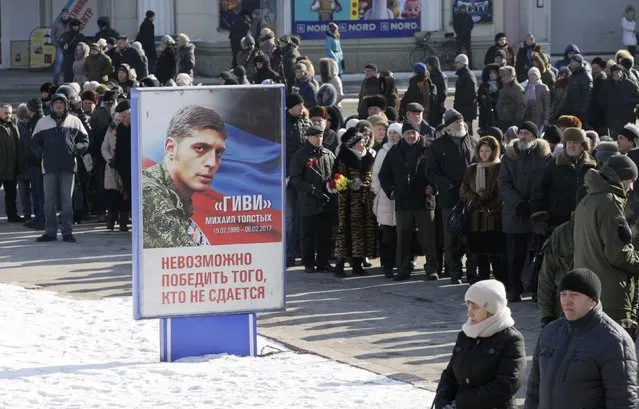 People attend a memorial service before the funeral of Mikhail Tolstykh, commander of the separatist self-proclaimed Donetsk People's Republic known by the nom de guerre “Givi”, in Donetsk, Ukraine, February 10, 2017. (Photo by Alexander Ermochenko/Reuters)