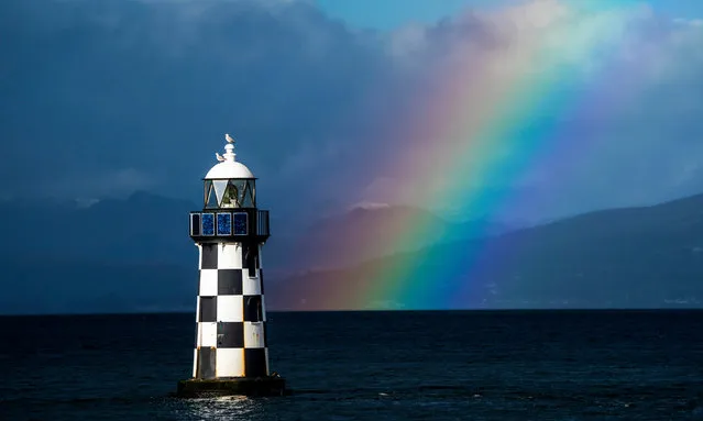 Rainbow behind Perch Lighthouse in the Clyde at Port Glasgow, Inverclyde, Scotland on Tuesday, February 13, 2024. (Photo by Jane Barlow/PA Images via Getty Images)