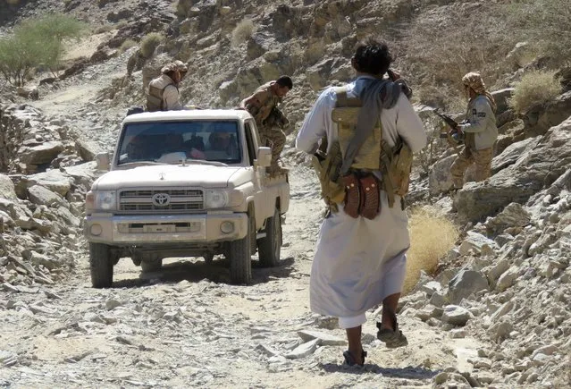 Fighters loyal to Yemen's Saudi-backed government deploy in a position of the al-Jawba frontline, facing Iran-backed Huthi rebels in the country's northeastern province of Marib, on October 24, 2021. (Photo by AFP Photo/Stringer)