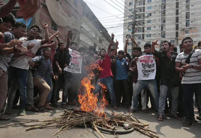 Bangladeshi students protest seeking arrest of three motorcycle-riding assailants who hacked student activist Nazimuddin Samad to death as he walked with a friend, in Dhaka, Bangladesh, Thursday, April 7, 2016. Police suspect 28-year-old Samad was targeted for his outspoken atheism in the Muslim majority country and for supporting a 2013 movement demanding capital punishment for war crimes involving the country's independence war against Pakistan in 1971, according to Dhaka Metropolitan Police Assistant Commissioner Nurul Amin. (Photo by AP Photo)