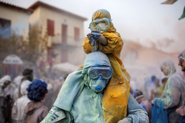 Revellers celebrate “Ash Monday” by participating in a colourful “flour war”, a traditional festivity marking the end of the carnival season and the start of the 40-day Lent period until the Orthodox Easter, in the port town of Galaxidi, Greece on February 27, 2023. (Photo by Alkis Konstantinidis/Reuters)