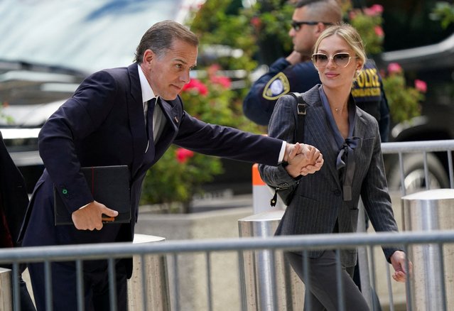 Hunter Biden, son of U.S. President Joe Biden, arrives at the federal court with his wife Melissa Cohen Biden, on the opening day of his trial on criminal gun charges in Wilmington, Delaware on June 3, 2024. (Photo by Kevin Lamarque/Reuters)