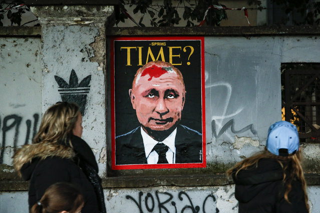 The new mural by street artist Harry Greb dedicated to the Ukrainian crisis in Rome, Italy on February 17, 2022. The poster, posted on the wall of the Lungotevere dei Tebaldi, depicts a hypothetical Time magazine cover that portrays the face of Russian President Valdimir Putin with a birthmark on his head in the shape of Ukraine (referring to the birthmark of Michail Gorbachev). (Photo by Fabio Frustaci/ANSA via ZUMA Press/Rex Features/Shutterstock)