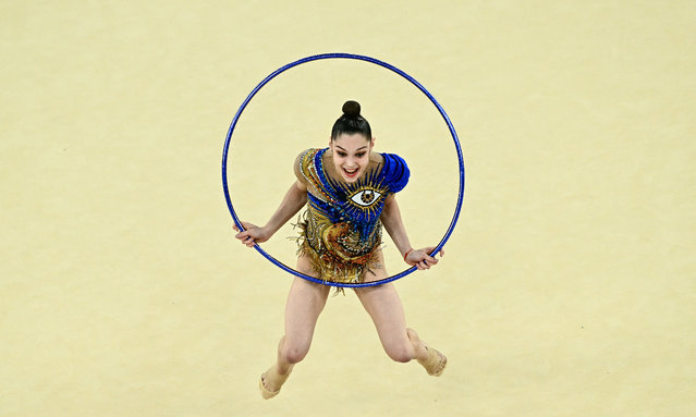 Israel's gymnasts perform with the hoop as they compete in the rhytmic gymnastics' group all-around qualification during the Paris 2024 Olympic Games at the Porte de la Chapelle Arena in Paris, on August 9, 2024. (Photo by Loic Venance/AFP Photo)