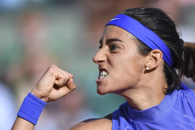 France's Caroline Garcia reacts after winning a point against France's Alize Cornet during their tennis match at the Roland Garros 2017 French Open on June 5, 2017 in Paris. (Photo by Francois Xavier Marit/AFP Photo)