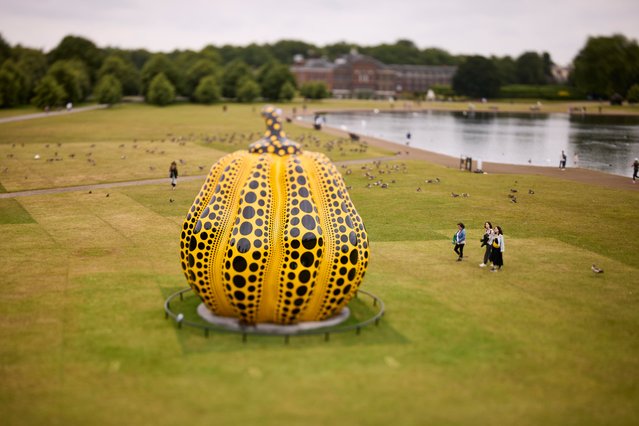 Pumpkin (2024), a new large-scale sculpture by the Japanese artist Yayoi Kusama, is installed by the Round Pond in Kensington Gardens in London as part of the Serpentine gallery’s public art presentations in the first decade of July 2024. (Photo by David Levene/The Guardian)