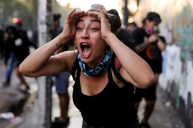 A demonstrator reacts during a protest against Chile's government in Santiago, Chile on December 20, 2019. (Photo by Pablo Sanhueza/Reuters)