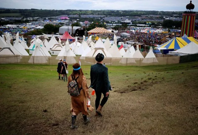 Revellers walk near The Park stage during the Glastonbury Festival at Worthy Farm in Somerset, Britain, June 23, 2016. (Photo by Stoyan Nenov/Reuters)