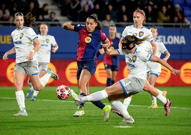 Barcelona's Portuguese forward #18 Kika Nazareth fights for the ball with St. Polten's midfielder #03 Anna Johanning during the UEFA Women's Champions League preliminary round 1 day 3 Group D football match between FC Barcelona and SKN St. Polten at the Estadi Johan Cruyff in Barcelona on November 12, 2024. (Photo by Josep Lago/AFP Photo)