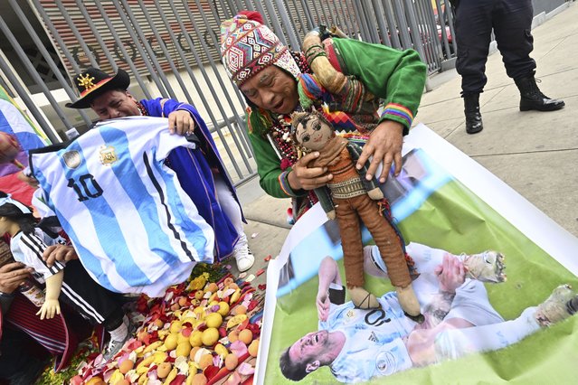 Peruvian shamans perform a ritual of predictions in front of the National Stadium in Lima, on October 16, 2023, a day ahead of the 2026 FIFA World Cup South American Qualifiers football match between Peru and Argentina. (Photo by Cris Bouroncle/AFP Photo)
