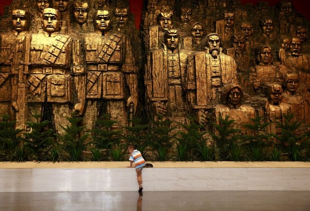 A boy stands in front of statutes at the Museum of the War of Chinese People's Resistance Against Japanese Aggression, in Beijing, China, September 1, 2015, two days ahead of the commemoration of the 70th anniversary of the end of World War Two. (Photo by Kim Kyung-Hoon/Reuters)