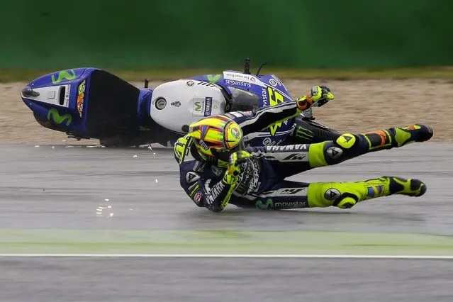 Yamaha MotoGP rider Valentino Rossi of Italy crashes during the first free practice session of the Italian Grand Prix at the Misano Adriatico circuit in central Italy September 12, 2014. (Photo by Max Rossi/Reuters)