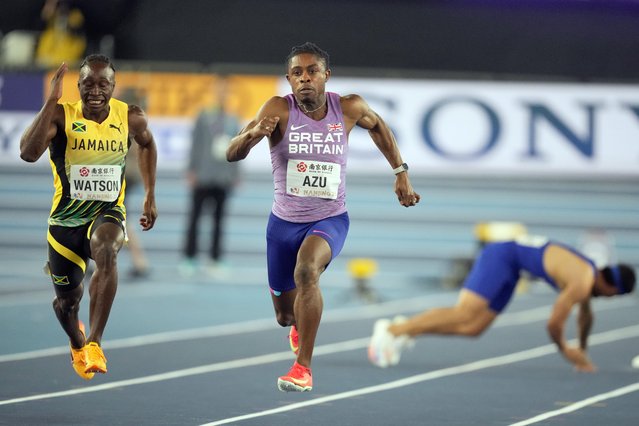 Jeremiah Azu, of Great Britain, and Rohan Watson, of Jamaica, compete in the men's 60 meters final while Eloy Benitez, of Puerto Rico, falls to the ground at the World Athletics Indoor Championships in Nanjing, China, Friday, March 21, 2025. (Photo by Dar Yasin/AP Photo)