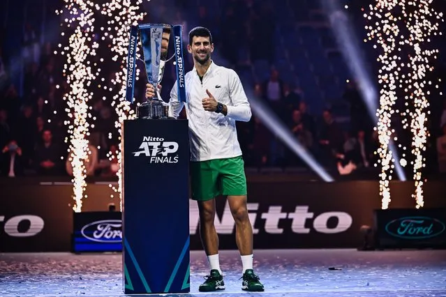 Serbia's Novak Djokovic poses with the winner's trophy after winning the men's single final match against Norway's Casper Ruud on November 20, 2022 at the ATP Finals tennis tournament in Turin. (Photo by Marco Bertorello/AFP Photo)