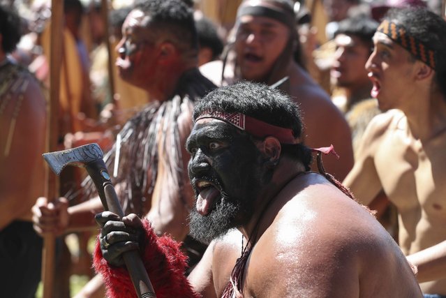Maori perform a welcome Dhaka for New Zealand Prime Minister Christopher Luxon and officials at the Waitangi Treaty House marae ahead of Waitangi Day celebrations in Waitangi, northern New Zealand, Monday, February 5, 2024. In a fiery exchange at the birthplace of modern New Zealand, Indigenous leaders strongly criticized the current government's approach to Maori, ahead of the country’s national day. (Photo by Michael Cunningham/NZ Herald via AP Photo)