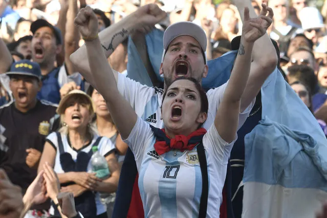 Argentina soccer fans reacts as watch their team's match against Mexico at the World Cup, hosted by Qatar, in Buenos Aires, Argentina, Saturday, November 26, 2022. (Photo by Gustavo Garello/AP Photo)