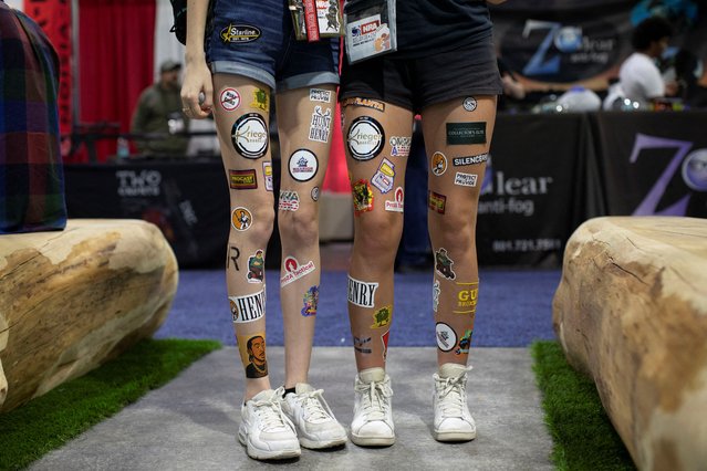 Attendees wear stickers they collected while on the exhibition floor during the National Rifle Association annual meeting in Atlanta, Georgia, U.S. April 25, 2025. (Photo by Alyssa Pointer/Reuters)