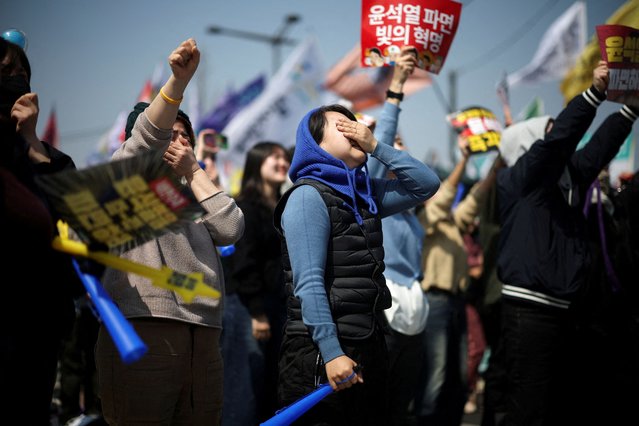 People celebrate after President Yoon Suk Yeol's impeachment was accepted, near the Constitutional Court in Seoul, South Korea, on April 4, 2025. (Photo by Kim Hong-ji/Reuters)