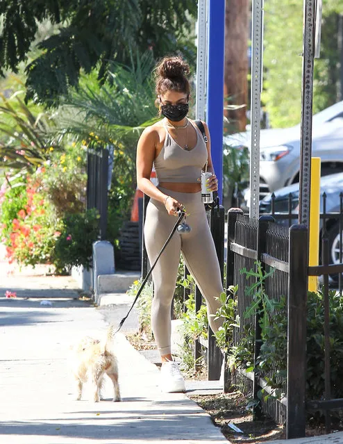 American actress and singer Vanessa Hudgens seen walking her dog and wearing a crop top and high-waisted leggings with her Naked Wolfe Sporty sneakers in Los Angeles on August 26, 2020. (Photo by Rex Features/Shutterstock)