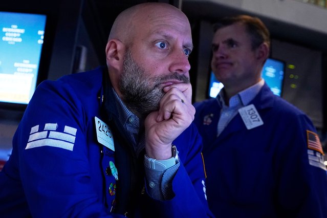 Specialist Meric Greenbaum, left, works at his post on the floor of the New York Stock Exchange, Thursday, April 17, 2025. (Photo by Richard Drew/AP Photo)