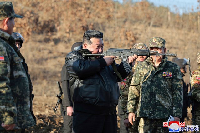 This picture taken on March 6, 2024 and released by North Korea's official Korean Central News Agency (KCNA) on March 7 shows North Korean leader Kim Jong Un (C) inspecting a major operational training base in the western area of the Korean People's Army (KPA) at an undisclosed location in North Korea. (Photo by KCNA via KNS/AFP Photo)