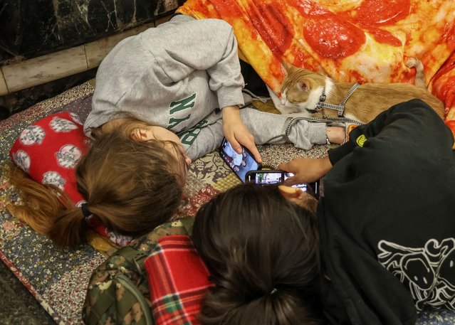 People take shelter inside a metro station during a Russian drone and missile strike in Kyiv, Ukraine on July 12, 2025. (Photo by Reuters/Stringer)