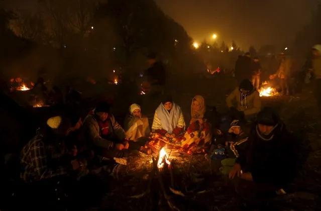 Migrants wait to cross the Slovenia-Austria border in Sentilj, Slovenia, October 27, 2015. (Photo by Srdjan Zivulovic/Reuters)