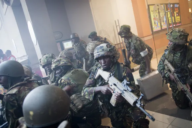 In this Saturday, September 21, 2013 file photo, armed police leave after entering the Westgate Mall in Nairobi, Kenya. A Kenyan court on Wednesday, Oct. 7, 2020 found two men guilty of supporting the 2013 attack by gunmen with the Somalia-based extremist group al-Shabab on Nairobi's upscale Westgate Mall that left 67 people dead, while Chief Magistrate Francis Andayi acquitted a third suspect. (Photo by Jonathan Kalan/AP Photo/File)