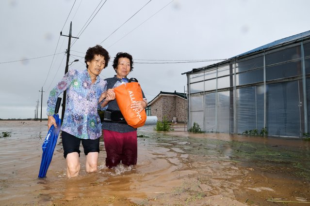 On the morning of the July 17, 2025, when a 100mm water bomb fell on Chungnam, residents near Sinsong-ri, Dangjin-si, Chungnam are escaping from their submerged homes. One resident said, “We left all our belongings behind in the rapidly rising rainwater since dawn”. (Photo by Park Seong-won)