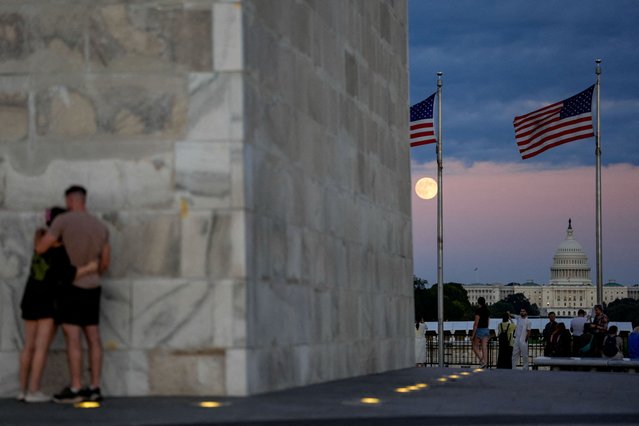 The first supermoon of the year, known as the Harvest Moon, rises above the National Mall, in view of the dome of the U.S. Capitol from the Washington Monument in Washington, on October 6, 2025. (Photo by Kent Nishimura/Reuters)