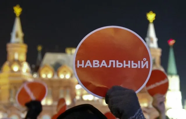 Supporters of Russian opposition leader and anti-corruption blogger Alexei Navalny hold a rally in protest against court verdict at Manezhnaya Square in Moscow December 30, 2014. The sign reads, “Navalny”. (Photo by Tatyana Makeyeva/Reuters)