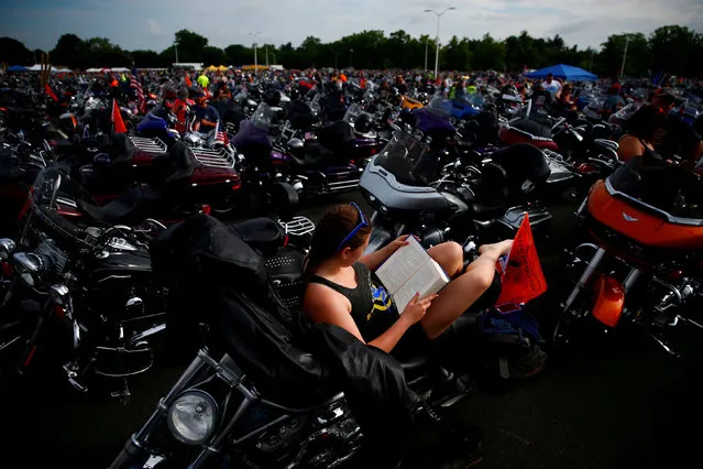 Participants gather in the parking lot of the Pentagon as thousands of military veterans and their supporters participate in the 31st annual Rolling Thunder motorcycle rally and Memorial Day weekend “Ride for Freedom” motorcycle procession in Washington, U.S., May 27, 2018. (Photo by Eric Thayer/Reuters)
