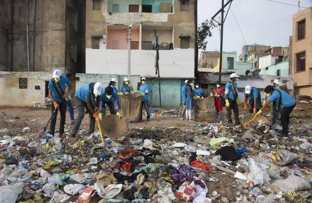 Members of National Green Corps clean up plastic garbage along the Musi river in Hyderabad, India, Sunday, June 3, 2018. India is the global host for the forthcoming environmental day celebrations on june 5, 2018 with a theme “Beat Plastic Pollution” and launched an awareness program on environmental protection. (Photo by Mahesh Kumar A./AP Photo)